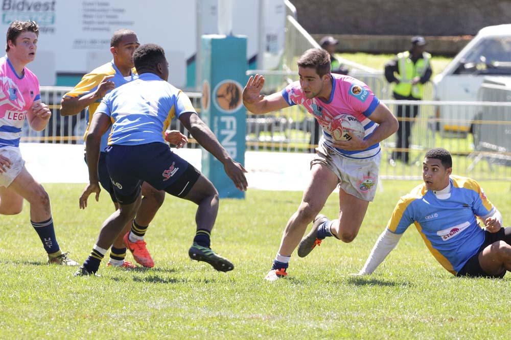 UCT rugby sevens players make sure to ward off the opposition in any way possible They ultimately went down to Stellenbosch University.