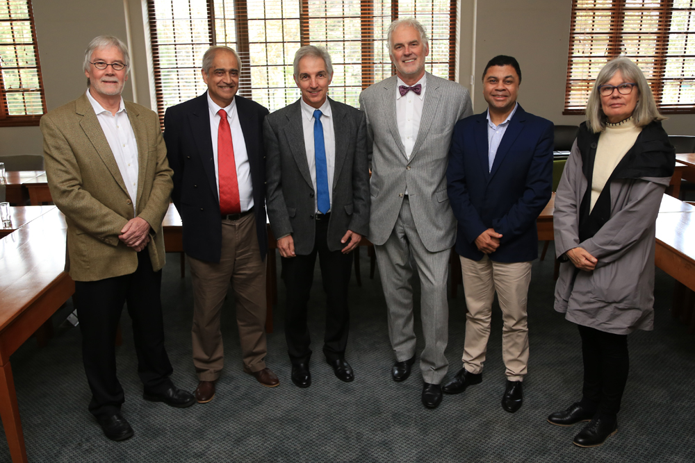 Professor Danie Visser, Professor Anwar Mall, Dr Max Price, Professor Walter Baets, Professor Francis Petersen and Professor Sandra Klopper pose for a final photo during a special farewell for Professor Baets after he stepped down as director of the Graduate School of Business in 2016.