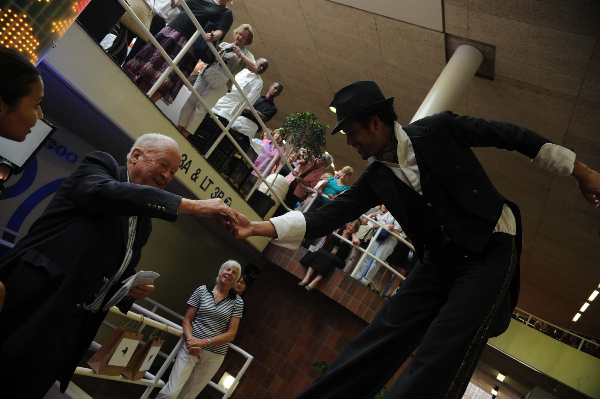 Summer School celebrated their 60th anniversary in 2010, with Saunders playing host at the reception with a difference. Here he is engaging with an interactive artwork – “Bits, Bites and Tweets” – in the Leslie Social Science Building.