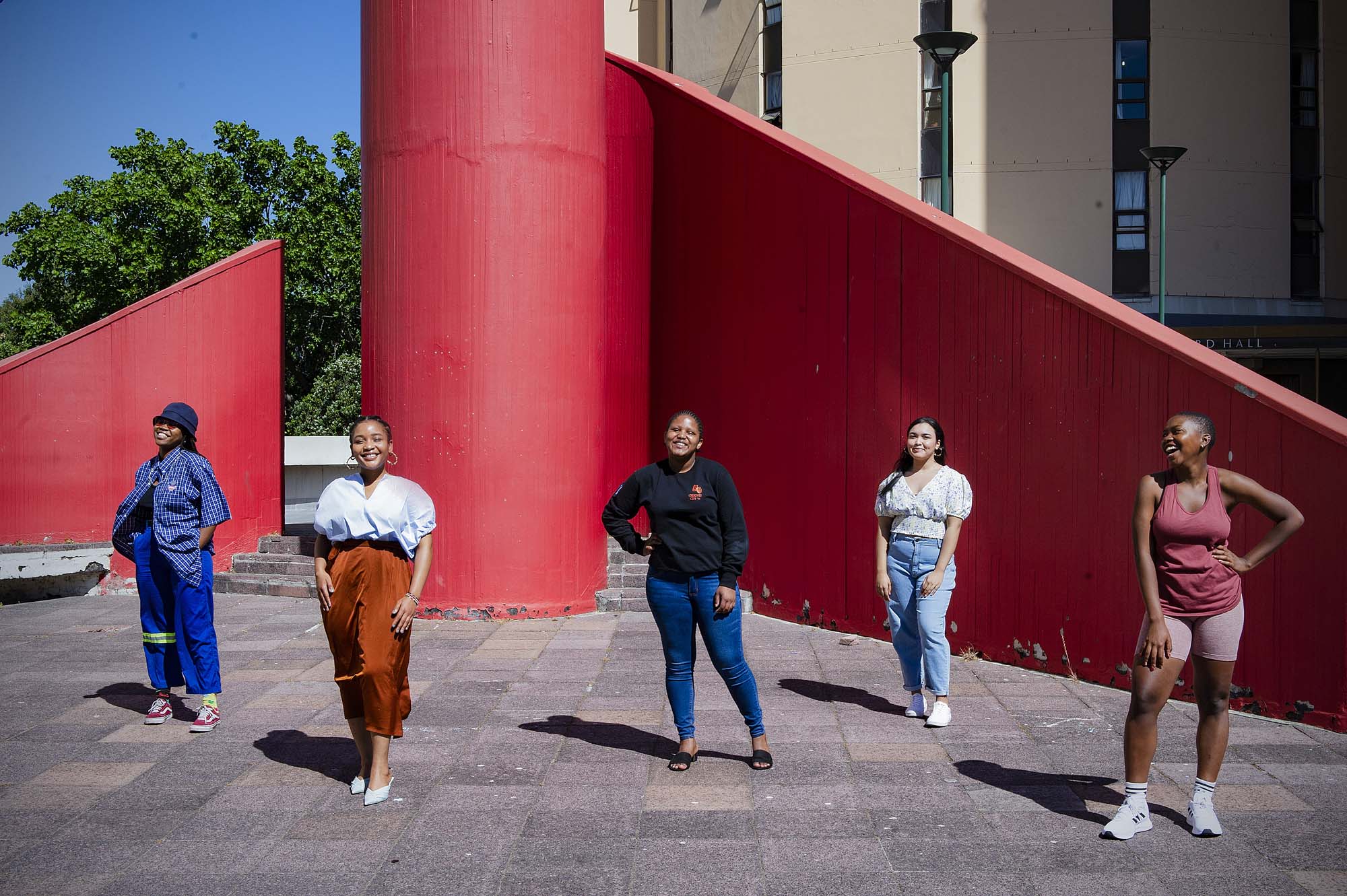 The Residence Life essay competition winner and runners up were photographed in front of Tugwell wall on lower campus.