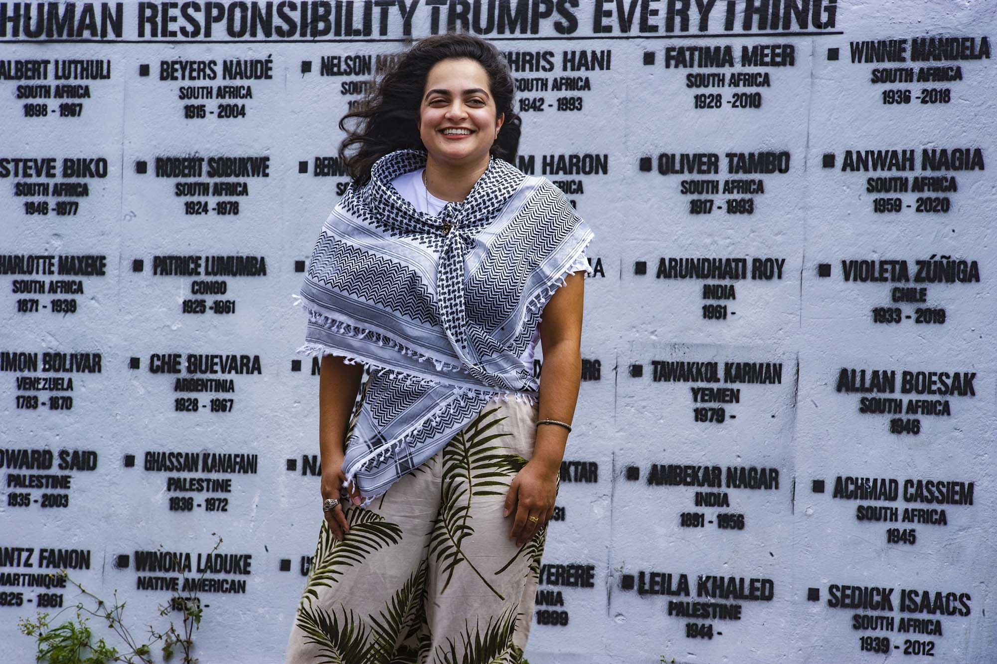 Inspirational graduate Aamirah Sonday was photographed in Salt River with mural art at the Salt River Historical Society.