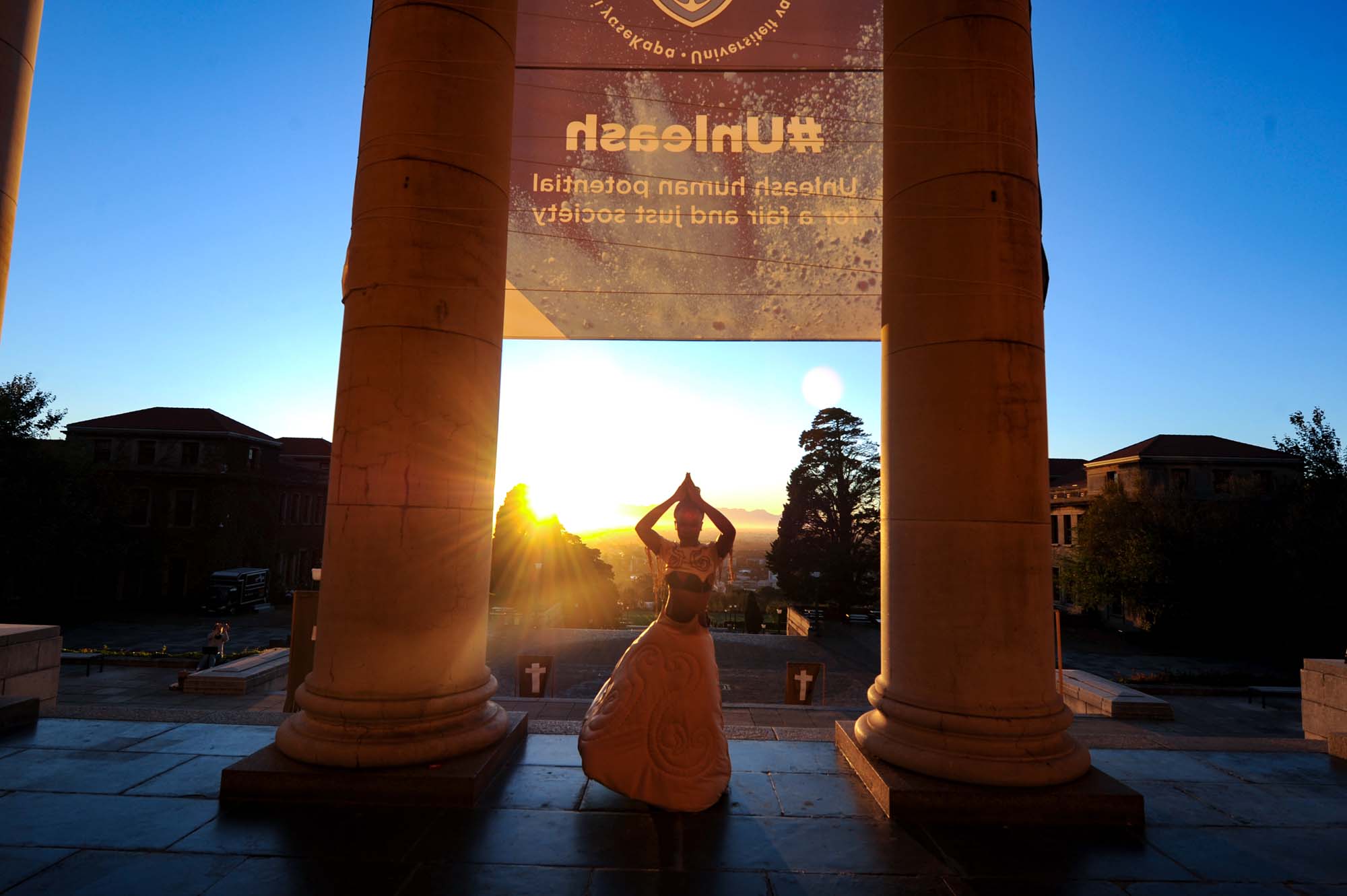 Artist Lukhanyiso Skosana performing in front of the Sarah Baartman Hall during “The Fire This Time” – a live art performance pop-up curated by the Works of Art Committee. Photo Lerato Maduna.