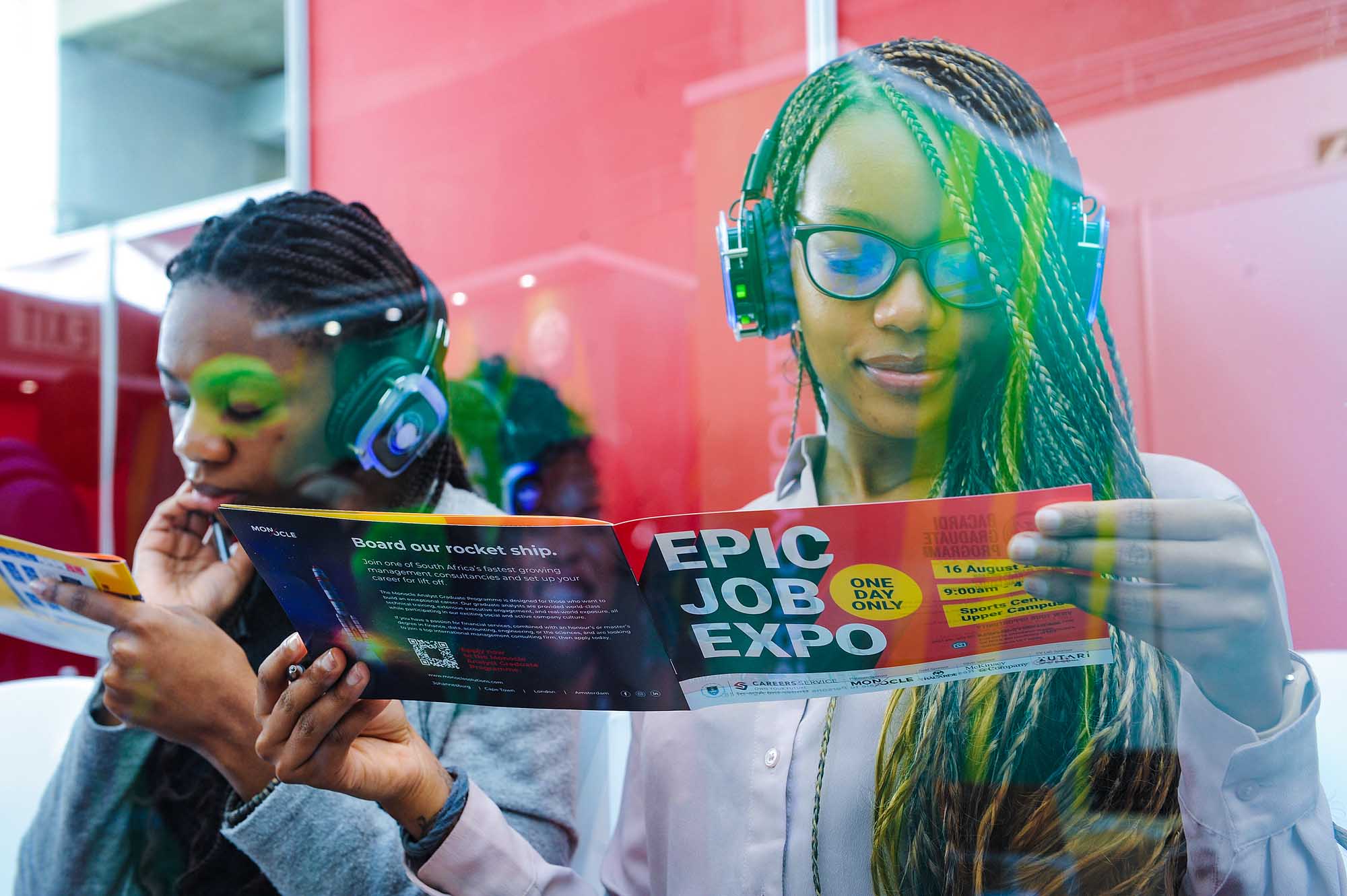 Annual Epic Job Expo booths from potential employers interacting with students inside the Sports Centre.