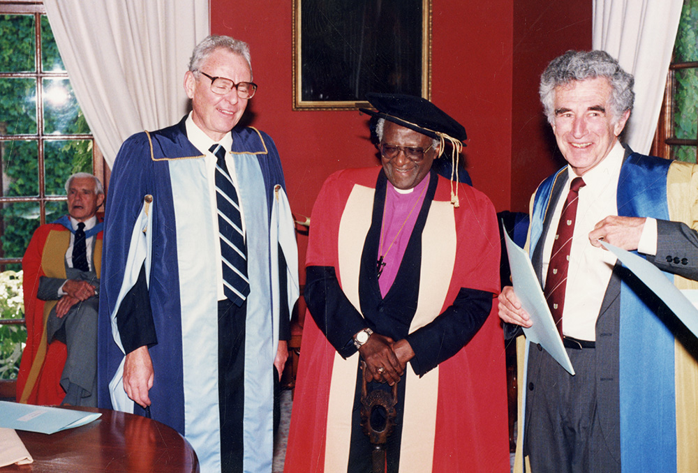 Archbishop Emeritus Desmond Tutu pictured with former UCT deputy vice-chancellor Professor D R Woods and Professor Maurice Kibel, the university orator, prior to his honorary degree ceremony in 1993. Seated in the window area is former UCT vice-chancellor Sir Richard E Luyt. Photo UCT Library Services Archives