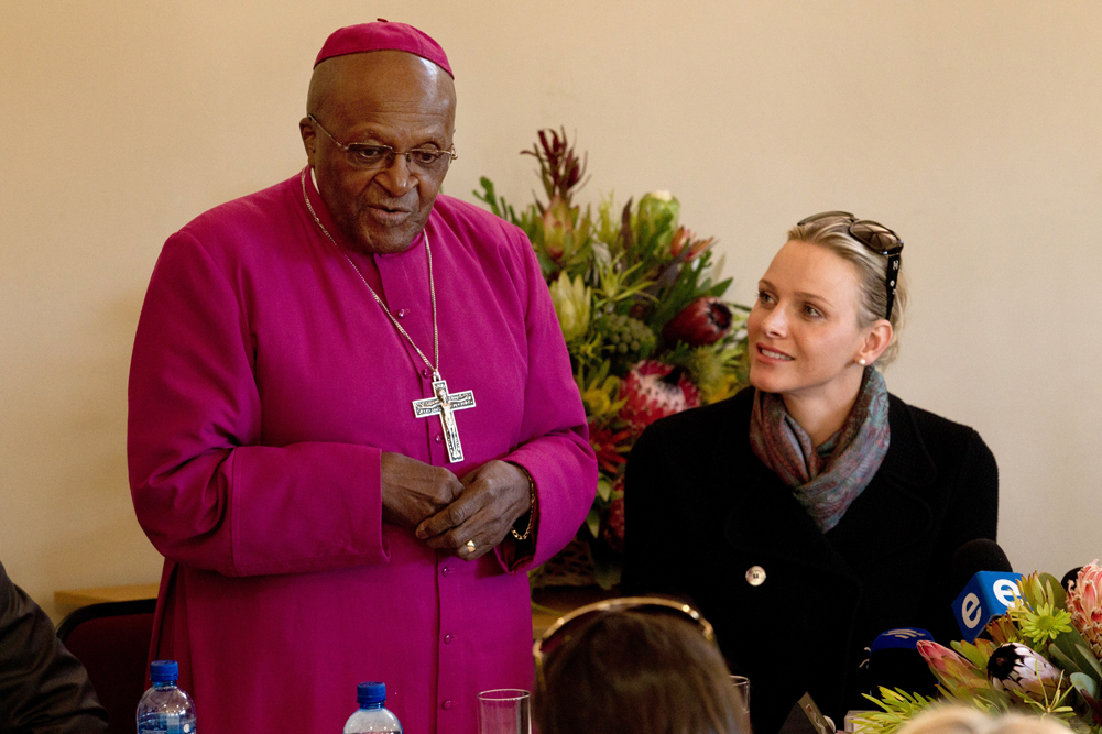 Princess Charlene of Monaco listens attentively as Archbishop Emeritus Desmond Tutu addresses the audience during her visit to the Desmond Tutu HIV Centre in July 2011. Photo Desmond Tutu HIV Foundation