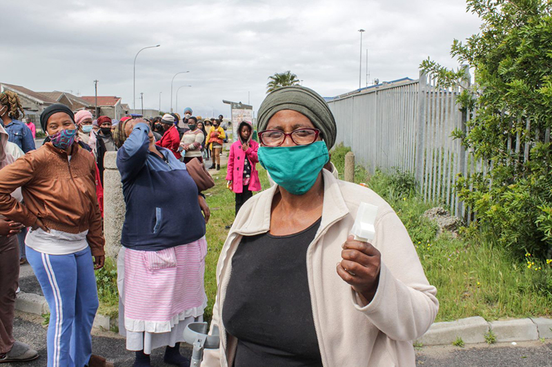 A queue of Khayelitsha community members ready to collect their multitools.