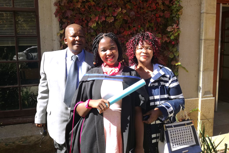 Nqabisa Faku with her parents on her graduation day