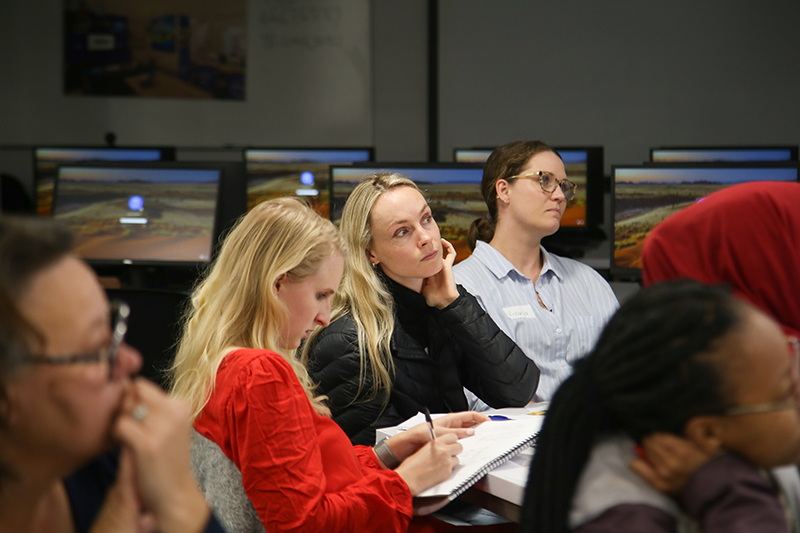 Teachers listen intently as the facilitator leads a Spring School workshop at UCT