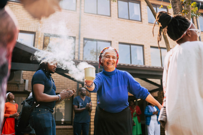 Dr Yvette Abrahams, the director of the San and Khoi Unit in the Centre for African Studies, performs a ritual ceremony with burning imphepho