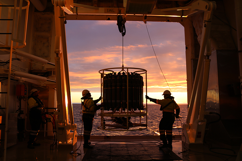 Scientific equipment being deployed in the Weddell Sea by the light of the Antarctic midnight sun.
